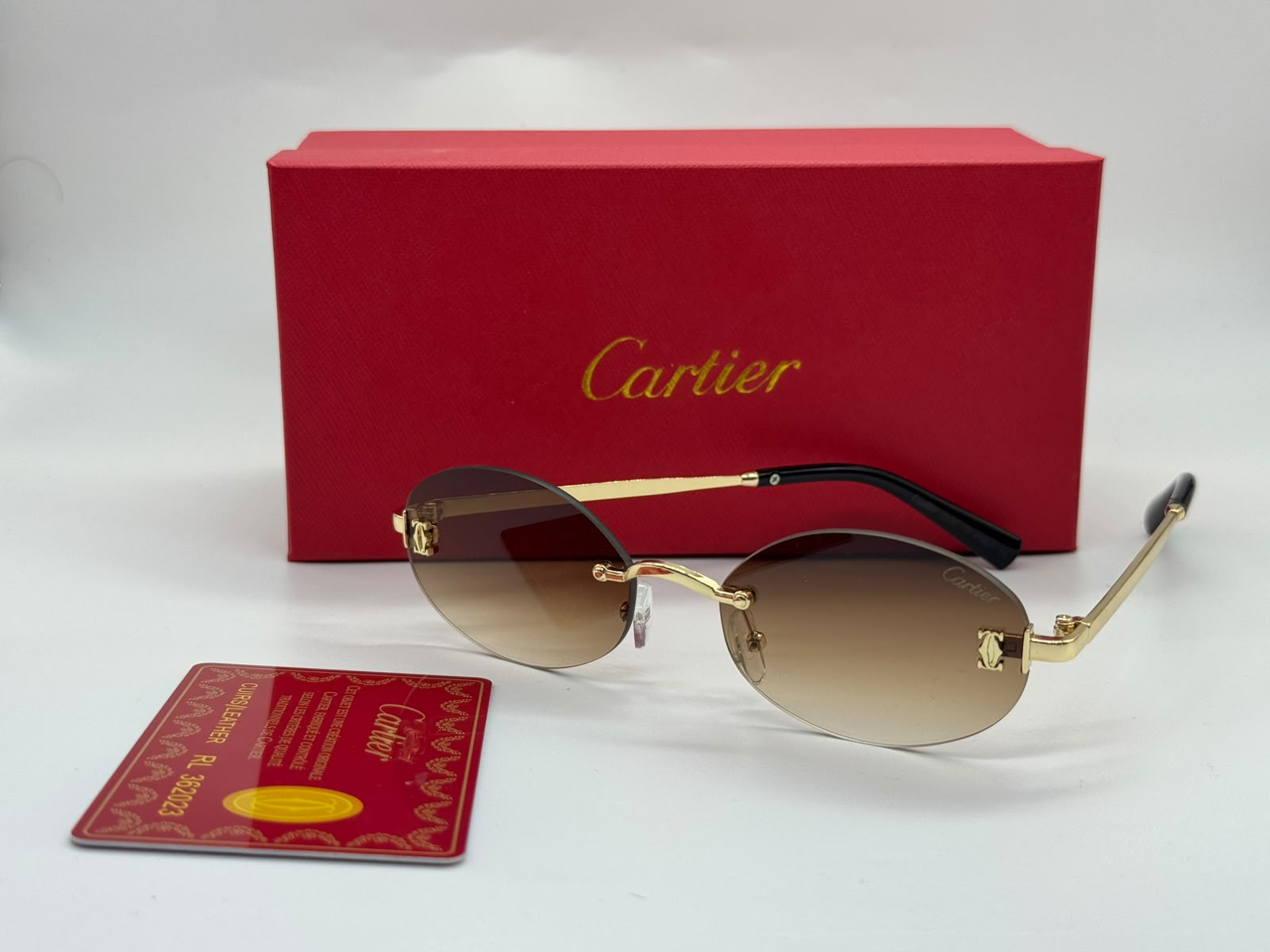Cartier | Première Rimless Sunglasses – Gold / Light Blue – Product Image 1