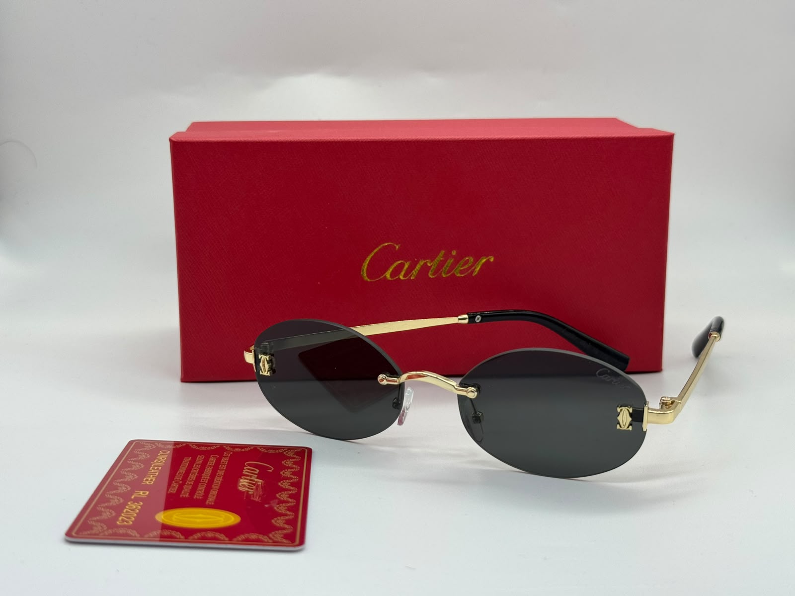 Cartier | Panthère de Cartier Rimless Glasses – Gold / Clear / Burgundy – Product Image 1