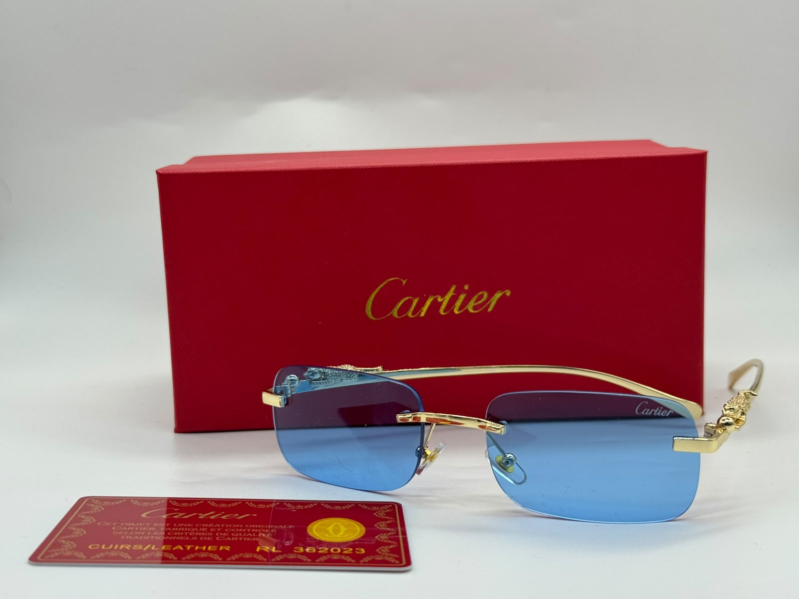 Cartier | Signature C de Cartier Rimless Sunglasses – Gold / Dark Grey – Product Image 1